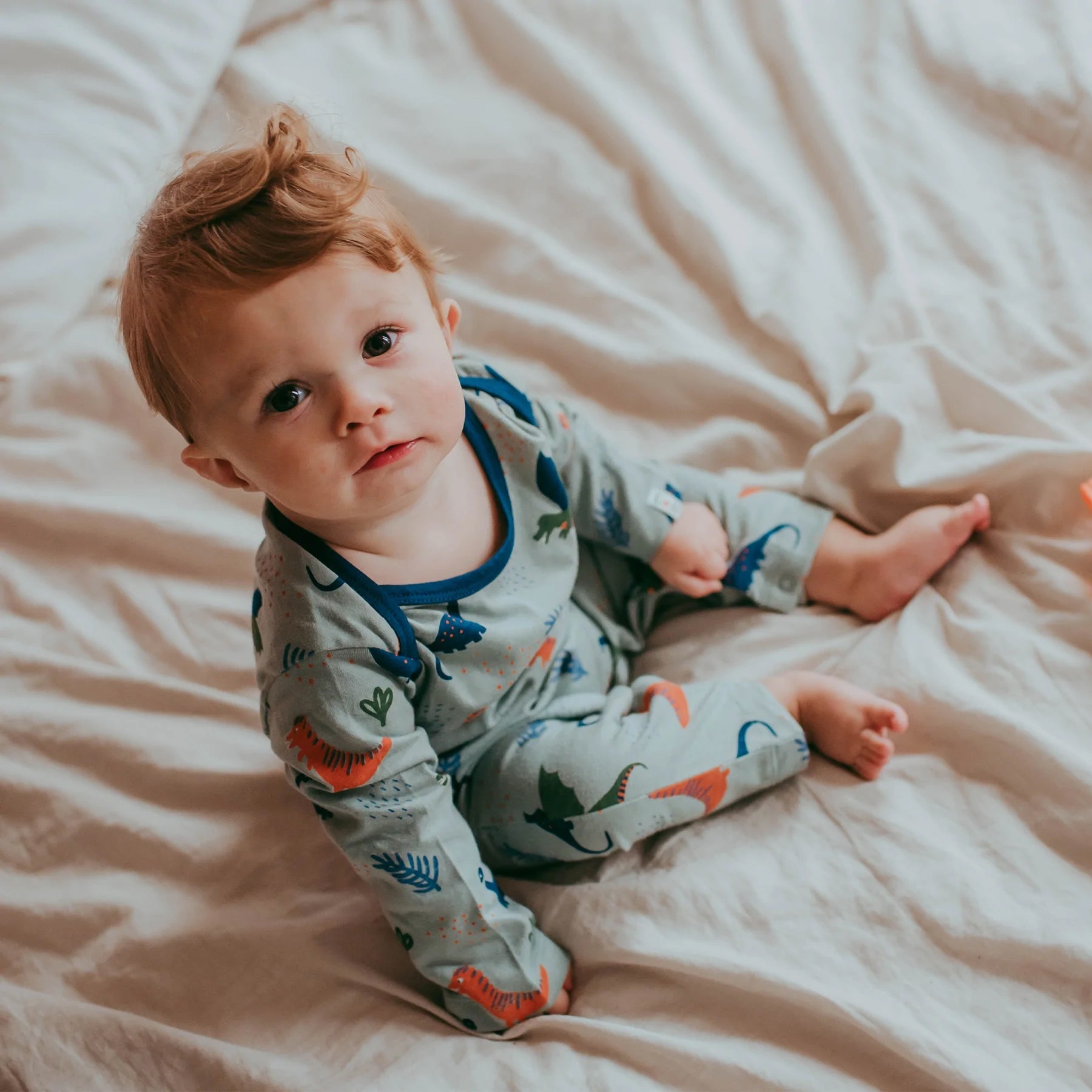 Dinosaur print playsuit: Size 3-6M