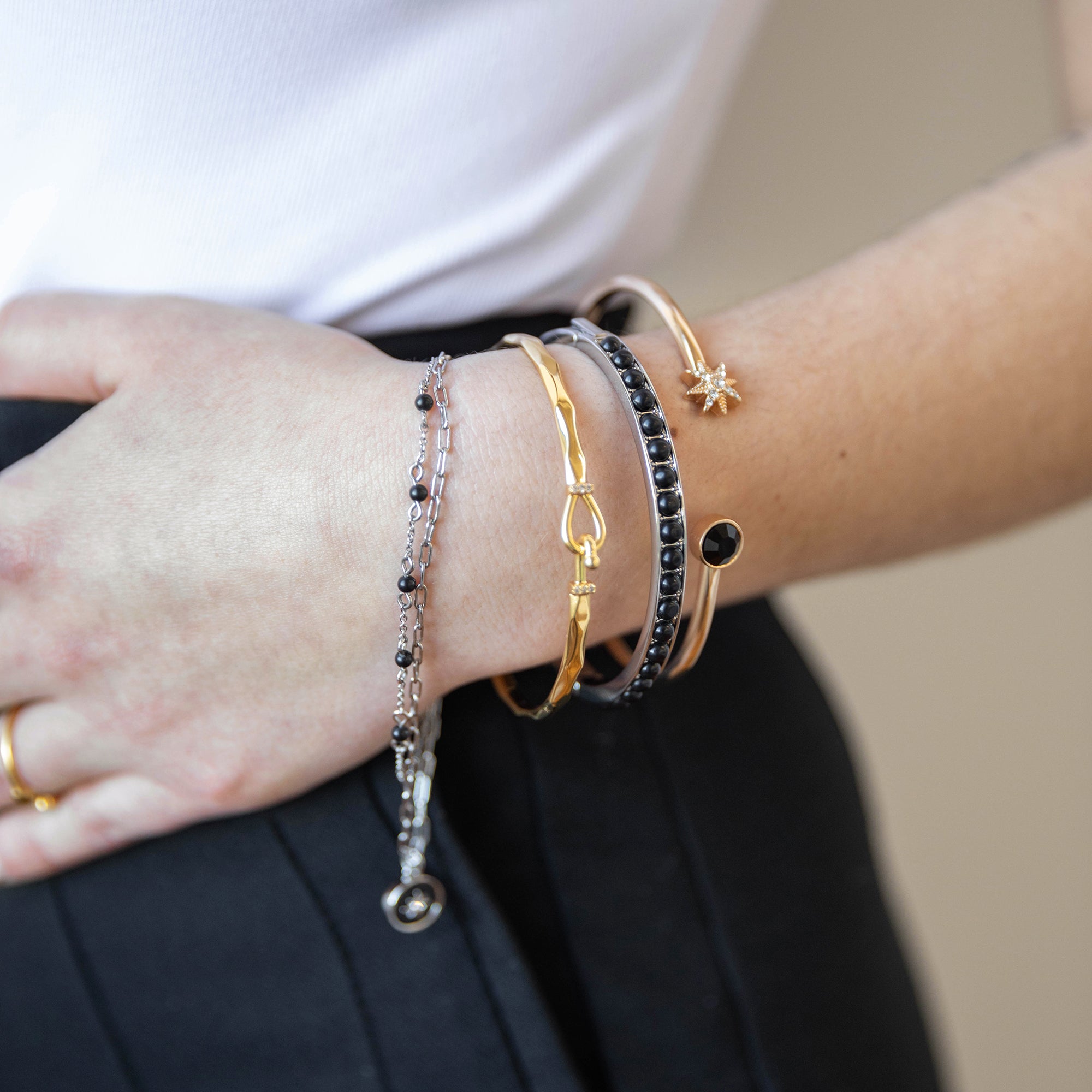 gemstone-hinge-bangle-black-on-model-layered-AA7520BO23SS_1.jpg