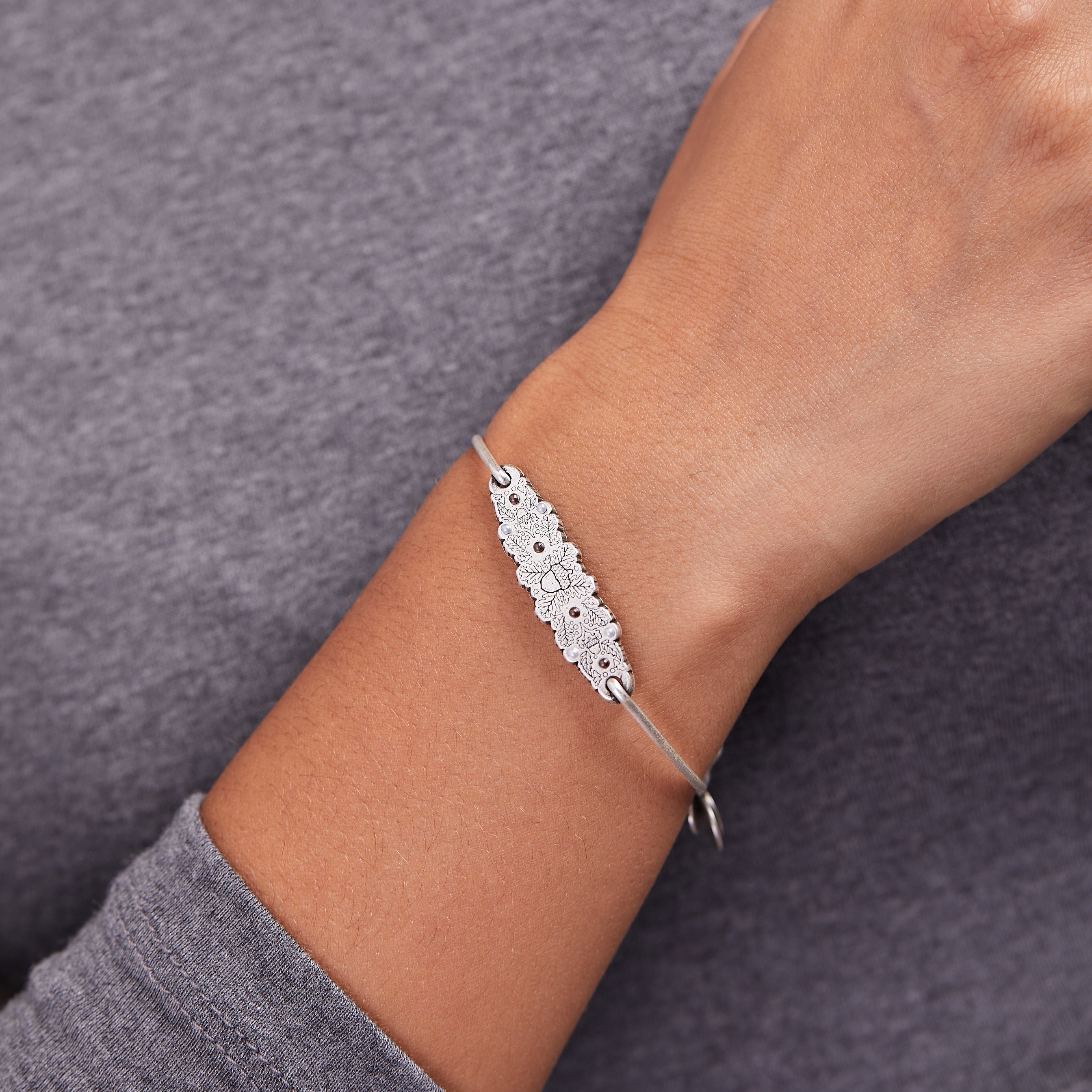 jeweled-acorn-inline-charm-bangle-bracelet-A21EBGNBRS38187.jpg