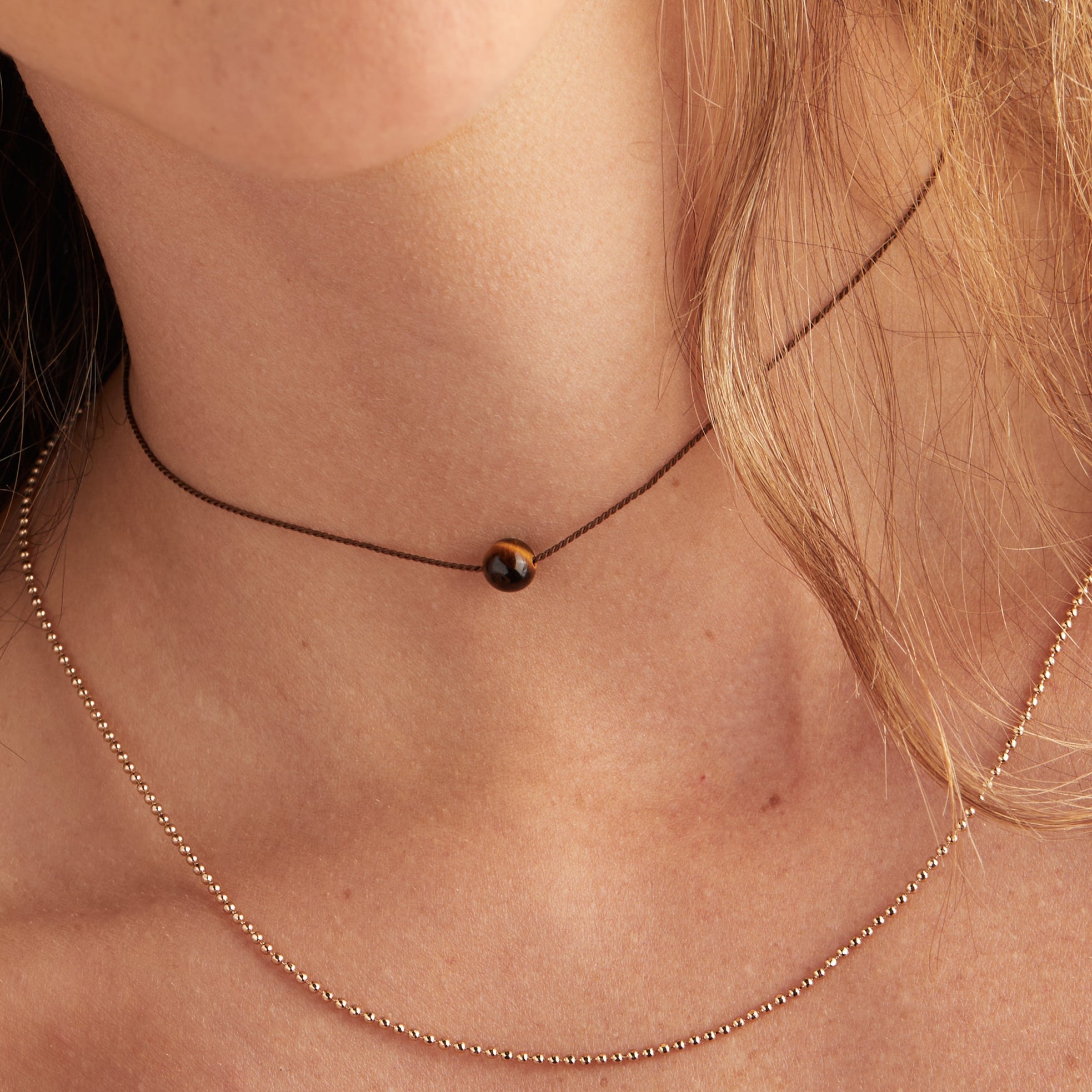 tigers-eye-gemstone-cord-necklace-on-model-AA670922SG.jpg