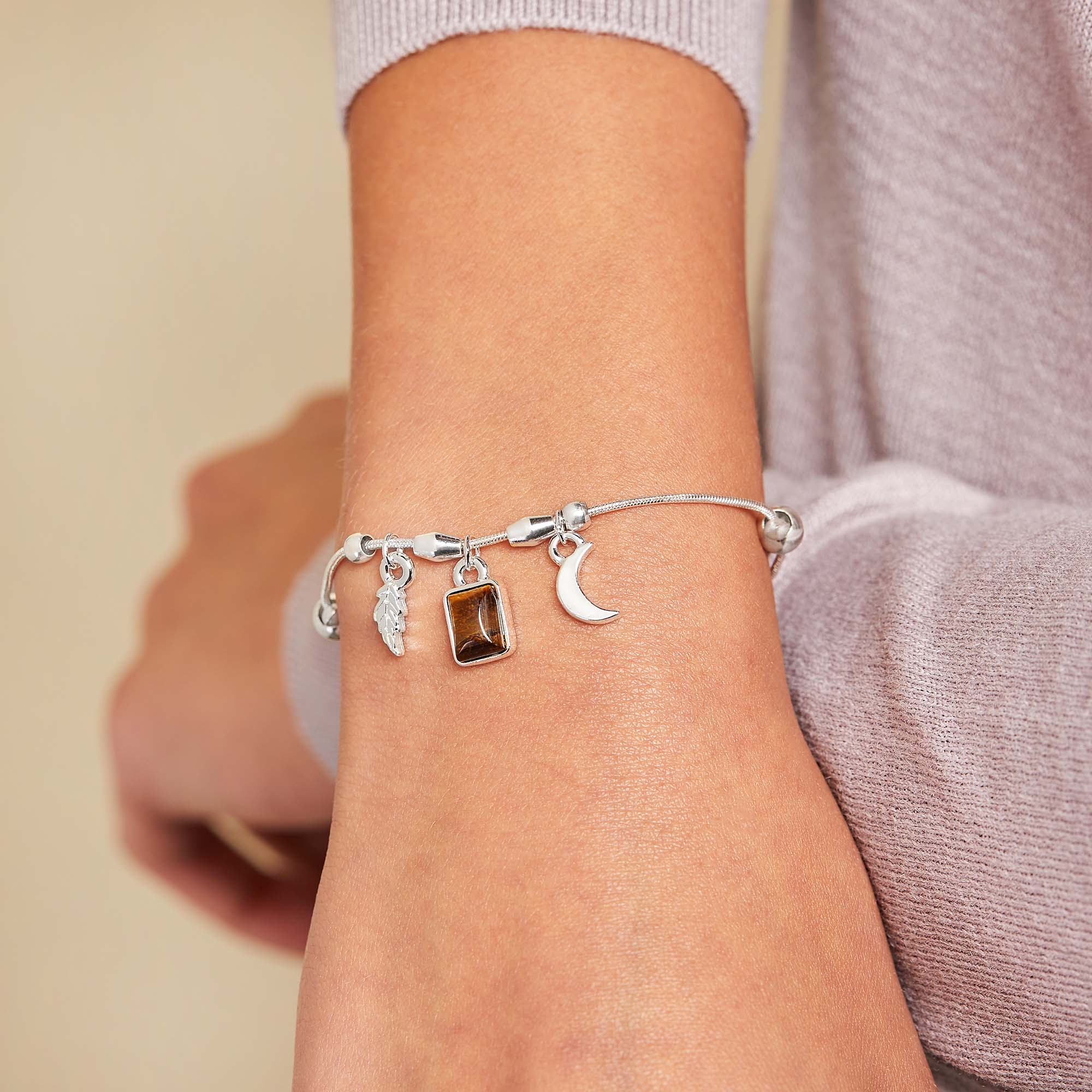 wisdom-potential-multi-charm-bracelet-on-model-A21EBWPSS.jpg